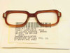 USS 6540-01-146-4276 military eyeglass frame front, rear three-quarter view showing hinge hardware and NSN label with April 1994 date code A-04/94 RMC 0002