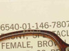 Close-up of USS 6540-01-146-7807 spectacle front bridge showing molded size marking RO 50-22 and NSN label detail