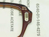 Close-up of USS 46-26 stamp and hinge hardware on brown cellulose acetate military spectacle frame