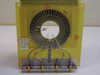 Das Device P00393 close-up of probe needle array and mounting bracket — label visible showing P00393, B704, 1/99 J; gold-plated mounting studs on lower bar