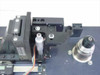 EDC 551A-DTS-05 spindle and linear slide mechanism closeup – showing PMI Kollmorgen spindle motor, precision positioning arm, slide rail, and optical/lens assembly
