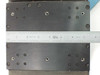 Lintech 47411 dual stage carriage top surface close-up with ruler confirming approximately 7.5" stage width and bolt hole grid pattern
