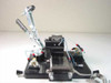 Custom vacuum chuck assembly three-quarter view showing full assembly with toggle clamp, pneumatic lines, steel block, and 23x21cm aluminum base