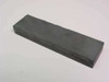 Pure Tech Inc Fe/Ta Cr alloy sputtering target — top view showing flat dark gray rectangular block