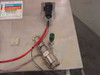 Detail of NFPA Xylene hazard label area with electrical connector, green vent fitting, and quick-disconnect coupling