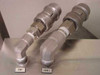 Two labeled stainless steel quick-connect couplings on elbow fittings – marked VENT and CHEM 2 – on cart shelf surface