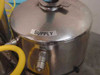 Close-up of stainless steel supply tank with SUPPLY and FILL labels and quick-disconnect fill port fitting