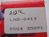 Close-up of Omega LAQ-0413 product label showing handwritten 212°C, part number LAQ-0413, and lot code 9504 35091