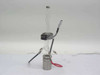 TMA quartz sample holder — alternate front angle showing black module clipped to glass tube mid-section and stainless base with wired connectors, white background