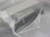Close-up of one connector end of the Alpha 5900/3 serial cable through plastic bag