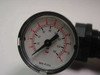 Close-up of Norgren R07-219RGKA regulator gauge face showing dual-scale dial: 0–160 PSI and 0–11 bar, Made in USA marking