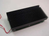 Applied Motion Products 1000-062B Step Motor Driver – top view of large black extruded aluminum heatsink with red wire leads attached