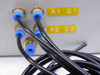 Rear of control box showing four pneumatic push-to-connect ports labeled A1, B1, A2, B2 with black tubing attached