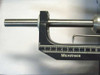 Close-up of detector snout and linear positioning rod on Microtrace scale showing approximately 10cm length