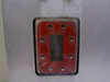 Close-up of waveguide port opening with red flange adapter plate showing rectangular waveguide aperture and mounting hole pattern