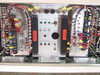 Aydin Monitor 6260-10 internal view – dual power supply bays (PS1 and PS2), central alarm and control panel with LED indicators, fuse panel, and wiring harness