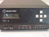 Black Box FT1-4 MTX-P front panel close-up with LCD displaying 'BLACK BOX FT1-4 V2.04 C', keypad, and illuminated ALARM LED under Network indicators