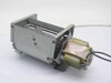 Kokusan Denki 2952301-3 vortex fan blower — rear-right angle showing motor coil, mounting bracket flanges, and blower scroll housing