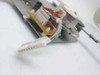 Underside view of carriage mechanism showing driver PCB, JST-style multi-pin connector, and wire harness routing