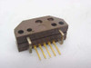 HP QEDS-9500 encoder assembly — angled rear view showing pin leads and mounting holes on brown housing