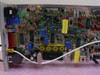 Scientific Atlanta 262180 Subcarrier Modulator — rear PCB view showing densely populated board with toroidal transformers, electrolytic capacitors, and interconnect wiring