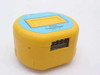 Unbranded yellow plastic Flow Transmitter — front-angle view showing rectangular display window, PO and R adjustment labels, and rear multi-pin connector block