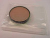 Oriel 57570 narrowband bandpass filter disc in clear plastic bag, 1-inch diameter, orange-tinted glass element