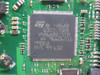 Close-up of STMicroelectronics V486AB controller chip on Seagate ST3200827AS PCB