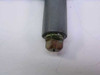 Close-up of bottom 1/4 NPT inlet end of manifold showing brass compression nut fitting and gray painted body