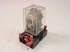 AMF Potter & Brumfield KAP11DG relay with clear plastic cover seated on black connection bracket socket — front-left view