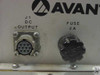 Close-up of Avantek PS-110-002 front panel J1 DC output multi-pin circular connector and 2A fuse holder