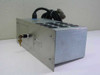 IVS IVS200 AC Power Control Distribution Module – 3/4 front-left view showing brushed aluminum enclosure, key lock on left side, IVS label, and 12 black circular outlet caps on top with coiled cable and military-style connector exiting rear