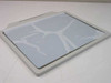 Spectrum GRX-17 Glass Glare Screen rear view showing protective plastic film still attached to glass surface with peel tabs visible