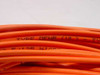 Close-up of orange cable jacket with printed text reading TYPE OFNR and UL marking on Siecor fiber optic cable