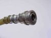 Close-up of quick-disconnect female fitting on the hose end — chrome metal coupling with knurled collar