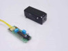 TBA 2800 IR receiver housing separated from PCB showing IC and blue capacitors with wire harness