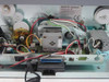 Evolis Kiosk printer interior showing wiring harness, stepper motors, parallel port connector, and IEC power inlet