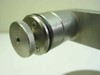 Close-up of knurled cylindrical end fitting with O-ring seal groove on arm assembly