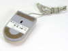 Sun Type 5 Optical Mouse 370-1398 — bottom view showing rating label, optical sensor opening, and velcro pad with DIN cable