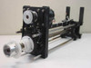 Mycom BRA85-10 apparatus – left-side view showing timing belt pulley, white hub, and lead-screw linear rail assembly