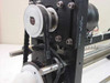Mycom BRA85-10 left-end assembly detail showing timing belt, PowerGrip belt markings, pulley, and black anodized bracket