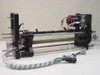 Mycom BRA85-10 stepper motor jig rotator apparatus – full assembly right-side view showing rails, motor, and wiring harness