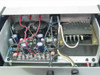 Power One PR1857 interior — open chassis view showing PCB with electrolytic capacitors, power transformer, and wiring to banana jack terminals
