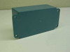 Pomona Electronics F-033 1.25 MHz Band Pass Filter — rear/bottom view of teal metal enclosure showing four corner mounting holes and clean exterior