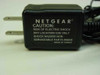 Netgear AC adapter – second view of power adapter caution label