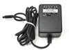 Microcom 13-0000004-001 modem power supply front and side view with label showing model number and specifications