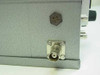 Left side panel of steel equalizer enclosure showing 4-pin circular connector and panel-mount BNC output connector