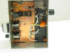 Interior top-down view of steel equalizer enclosure showing PCB with RF circuitry, inductors, and internal wiring
