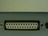 Close-up of DB25 female 25-pin D-sub connector on the steel interface box end panel