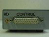 Close-up of DB25 female control connector with RD label and gold BNC/pin connector on front panel